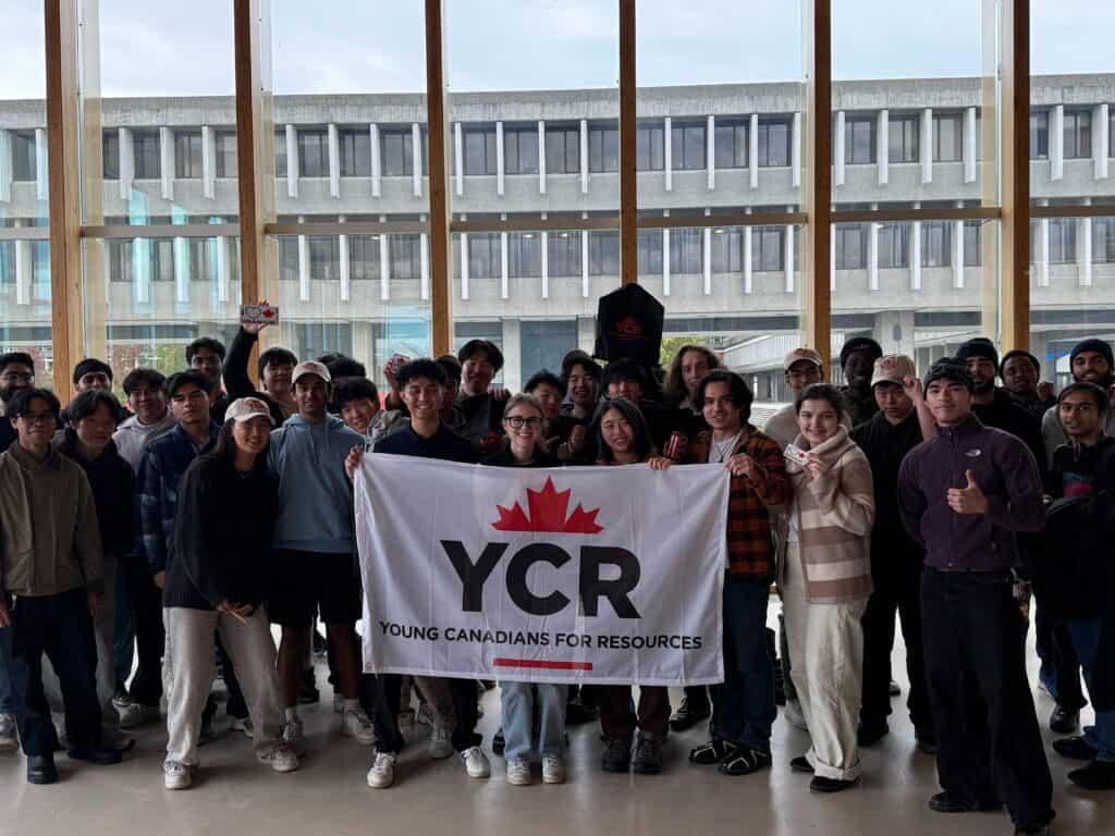 Diverse group of young Canadians holding a "YCR" banner at a regional chapter event, promoting youth engagement and resource sharing across communities.