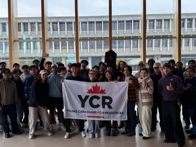 Diverse group of young Canadians holding a "YCR" banner at a regional chapter event, promoting youth engagement and resource sharing across communities.